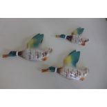 Three ceramic flying ducks, largest 19cm, all good