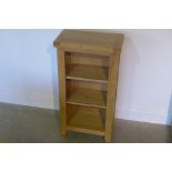 An oak bookcase with adjustable shelves, 92cm tall x 50cm x 30cm