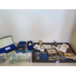 A collection of coins and other items to include a silver proof stamp, 2.39 troy oz, a spelter