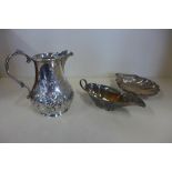 A silver jug with embossed decoration, London 1864 - DC Houle, a silver shell dish, Birmingham