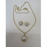 A 9ct gold pearl pendant on a 9ct chain marked 375, with a pair of near matching hallmarked 9ct