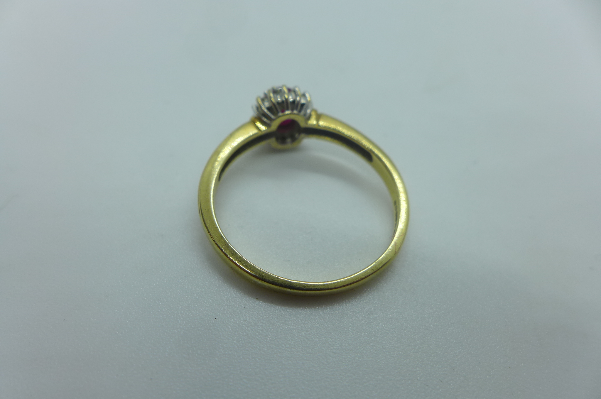 A hallmarked 9ct yellow gold ruby and white stone ring, size X, approx 3.6 grams, generally good - Image 3 of 3