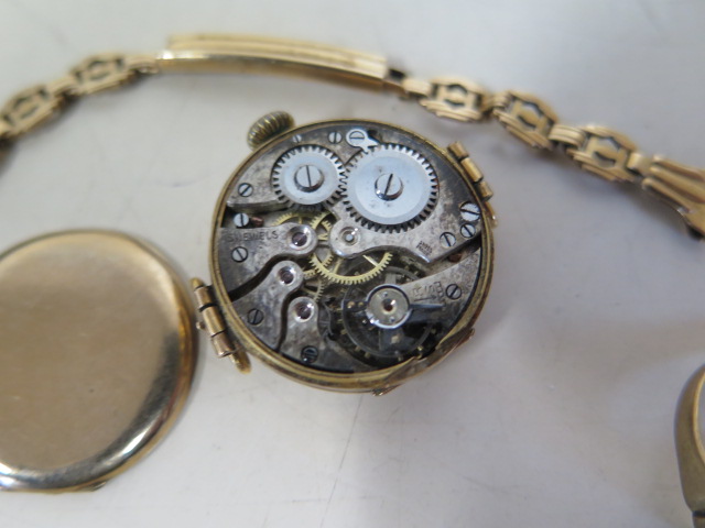 A 9ct yellow gold ladies manual wind wristwatch on a 14ct sprung strap, and a 9ct cut ring, back off - Image 2 of 2