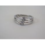 An 18ct hallmarked white gold three stone diamond approx 0.25ct - approx weight 3.1 grams - size N -