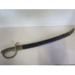 A Victorian hanger sword with brass handle and leather scabbard, stamped V1887, blade length 59.5cm,