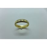 A hallmarked 9ct yellow gold band ring, set with five small diamonds, size W, approx 3.3 grams,