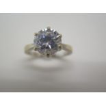 A hallmarked 18ct white gold solitaire dress ring, size O/P, approx 5.8 grams, some abrasions but