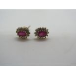 A 9ct yellow gold ruby and diamond earrings, as new - approx weight 1.0 gram