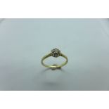 A hallmarked 9ct yellow gold diamond cluster ring, size V, approx 2.2 grams, generally good