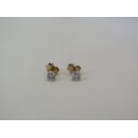 An 18ct yellow gold solitaire diamond studs, approx 0.20ct, 9ct backs - approx weight 0.6 grams