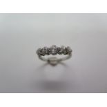 A platinum five stone diamond ring, size K/L, approx 3.4 grams, in good condition, minor wear