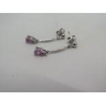 An 18ct white gold and pink sapphire drop earrings, with 9ct backs - as new - weight approx 1.5