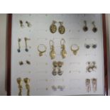 A pair of 18ct black pearl earrings, and a collection of assorted gold and plated earrings, total