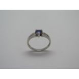 A 9ct hallmarked white gold tanzanite and diamond ring, size M, approx 2 grams, in good condition