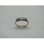 An 18ct five stone diamond ring, size S/T approx 2.8 grams, marked 18ct, some wear but generally