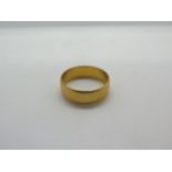 A hallmarked 22ct yellow gold band ring, size P, approx 5.3 grams, general usage wear