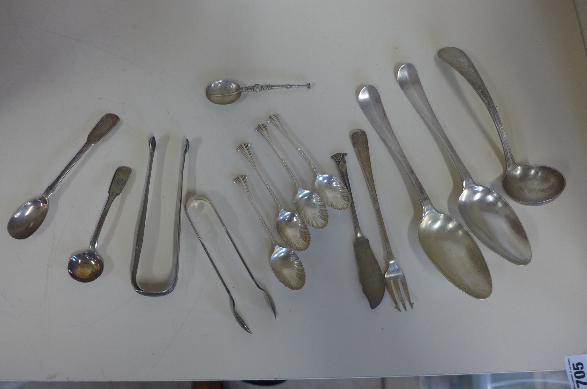 Assorted silver flatware including a pair of continental spoons and a continental ladel, total