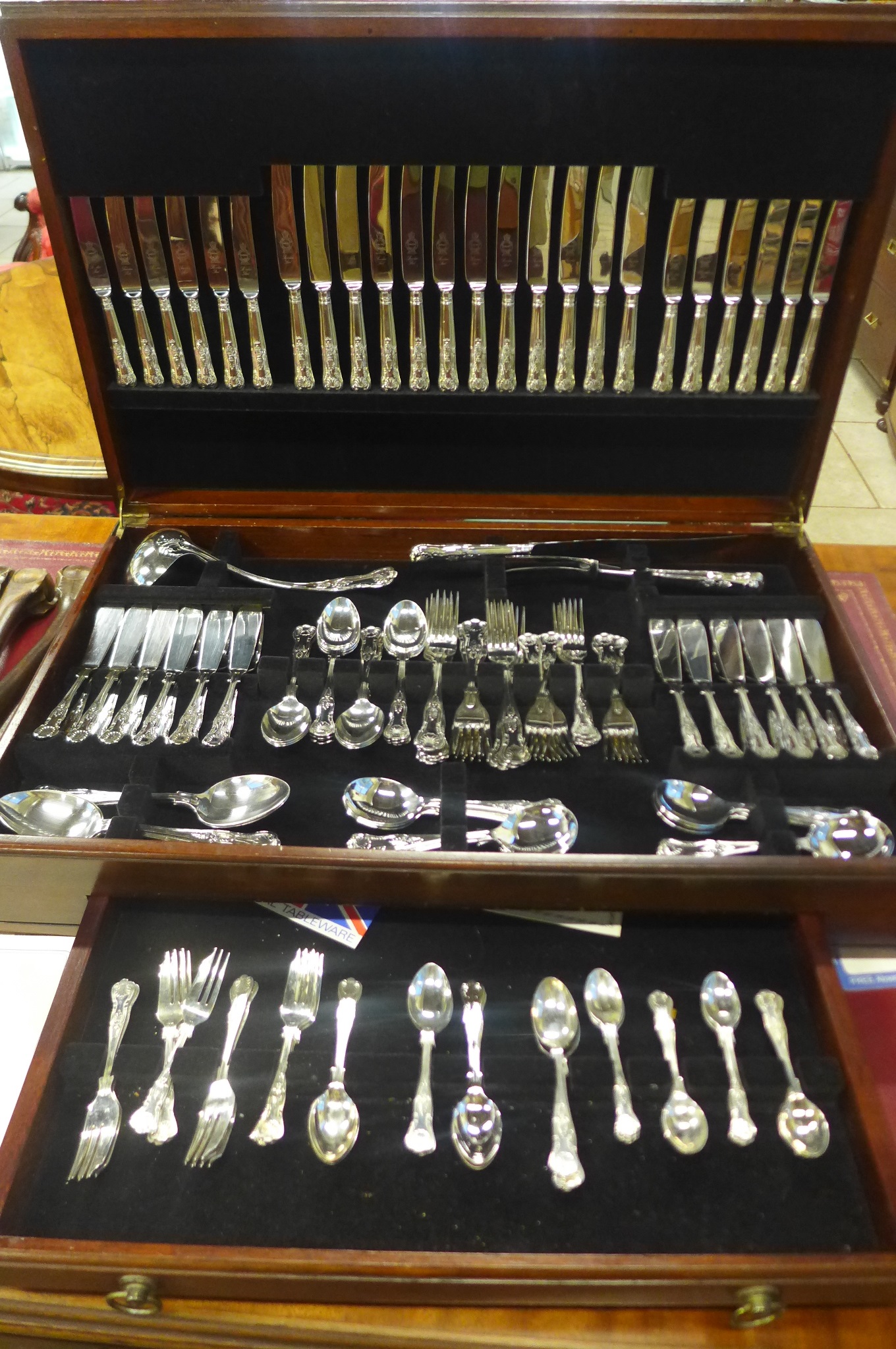 A twelve setting Sheffield AI plate canteen of Kings pattern plated flatware with attachable legs,