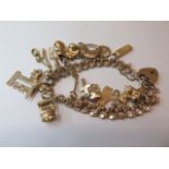 A 9ct yellow gold charm bracelet, approx 36 grams