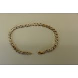 A 9ct diamond set line bracelet, 18cm long, approx 5.9 grams, generally good, one link has been