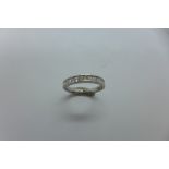 An 18ct white gold princess cut diamond half eternity ring from Beaverbrooks, 0.25ct, 2.2 grams,