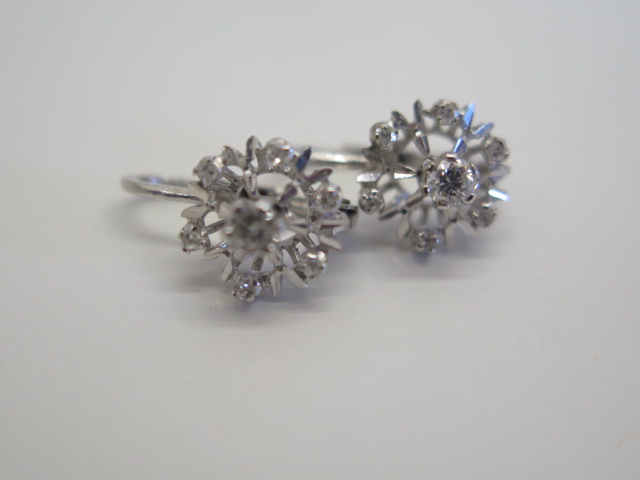 A pair of 18ct white gold cluster diamond earrings, 10mm wide, approx 3 grams, in good condition