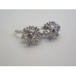 A pair of 18ct white gold cluster diamond earrings, 10mm wide, approx 3 grams, in good condition