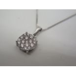 An 18ct white gold diamond pendant approx 1.0ct - on a 9ct chain, approx weight 4.0grams, as new