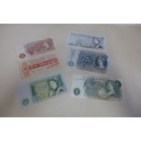 A John Bradbury ten shilling note, No A14 198155 - 2 x Five pound notes, 2 x pound notes, and a