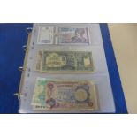 An album of 50 world bank notes