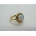 A yellow gold opal and diamond ring, tests to 18ct ring size M/N, approx 6.7 grams, opal approx 9.