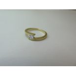 An 18ct hallmarked yellow gold square solitaire, approx 0.25ct, approx weight 3.1 grams - as new -