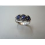 An 18ct hallmarked white gold sapphire and diamond ring, weight approx 3.6 grams, size M 1/2 - as