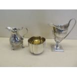 Two silver cream jugs, and a silver cup, total weight approx 9 troy oz