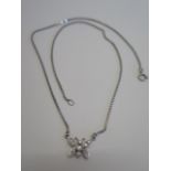 A diamond insect necklace in white metal, possibly white gold, 43cm long, approx 4.5 grams, in