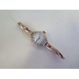 A 9ct yellow gold ladies manual wind wristwatch, on a sprung strap, not working, total weight approx