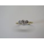 A yellow gold three stone diamond ring, tests to approx 18ct, ring size T, approx 1.7 grams, some