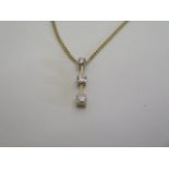 An 18ct yellow gold three stone diamond pendant, approx 0.25ct - on an 18ct chain, as new, approx