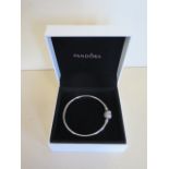 A Pandora silver sparkling heart bracelet, boxed, in good condition