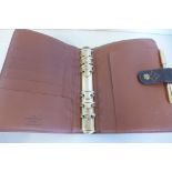 A Louis Vuitton filofax type binder, with pencil 19x14cm - in generally good condition, little