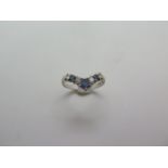 A hallmarked 18ct white gold diamond and sapphire wishbone ring, size O, approx 2.8 grams, some