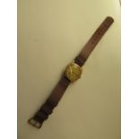 An interesting football presentation 9ct manual wind wristwatch with a terminus Swiss movement,