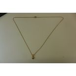 A 9ct gold and diamond pendant on a gold chain - approx 2.6 grams, in good condition