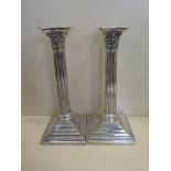 A pair of silver column candlesticks with presentation engraving, dated 1903 - 24cm tall,