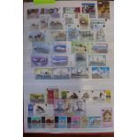 A World stamp collection in a large stock-book with many sets both used and mint scattered