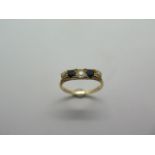 An 18ct hallmarked yellow gold diamond and sapphire half hoop ring, diamond weight approx 60pts,
