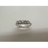 An 18ct hallmarked white gold five stone diamond ring, approx 0.25ct - weight approx 3.5 grams, as