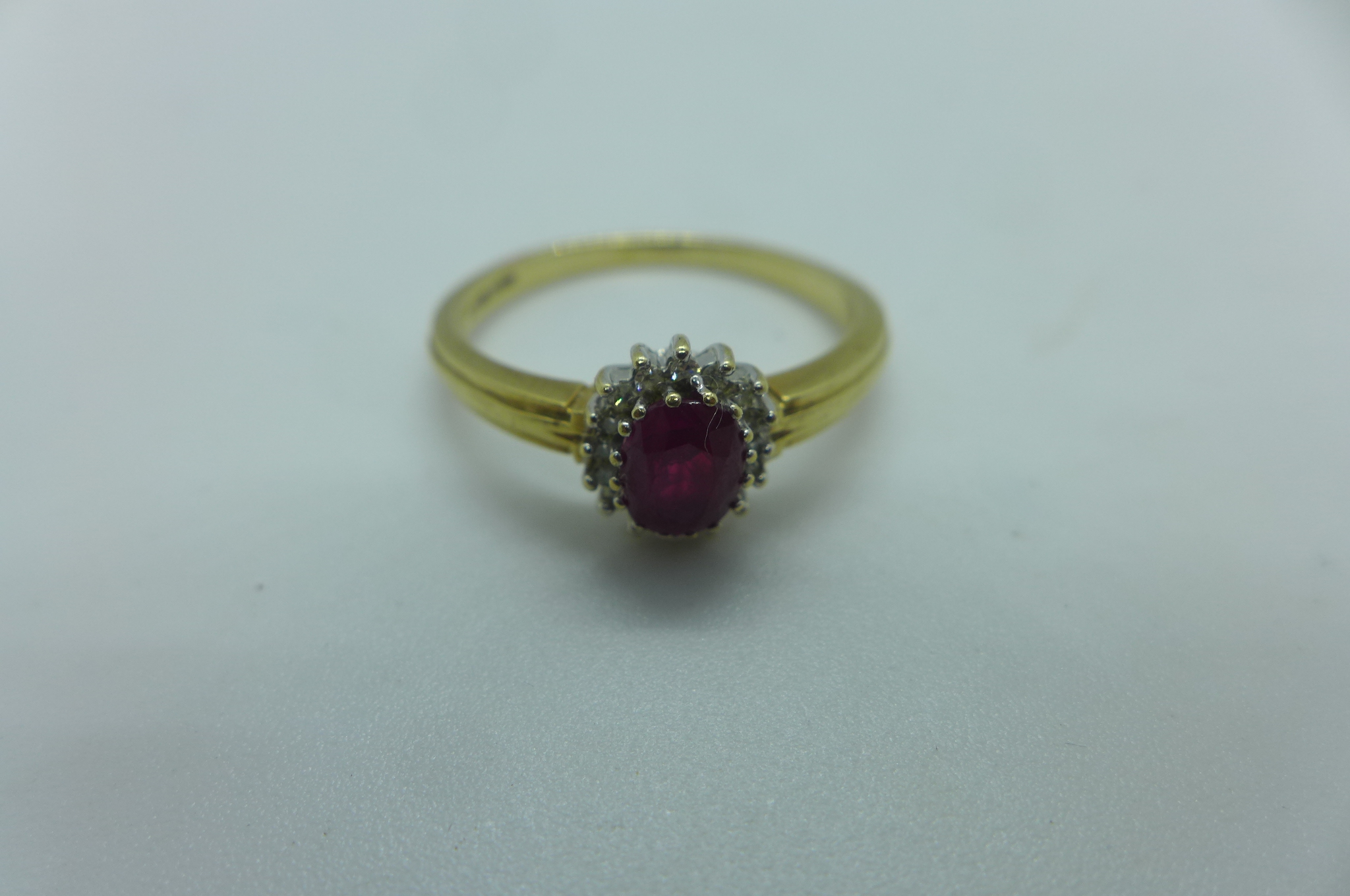A hallmarked 9ct yellow gold ruby and white stone ring, size X, approx 3.6 grams, generally good - Image 2 of 3