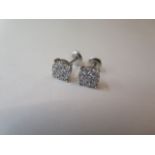 A pair of 18ct white gold diamond cluster earrings, with screw backs, 7mm diameter, approx 2