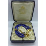 A vintage 18ct tested gold and Lapis Lazuli worry beads, 23cm long, approx 24 grams, minor loss to